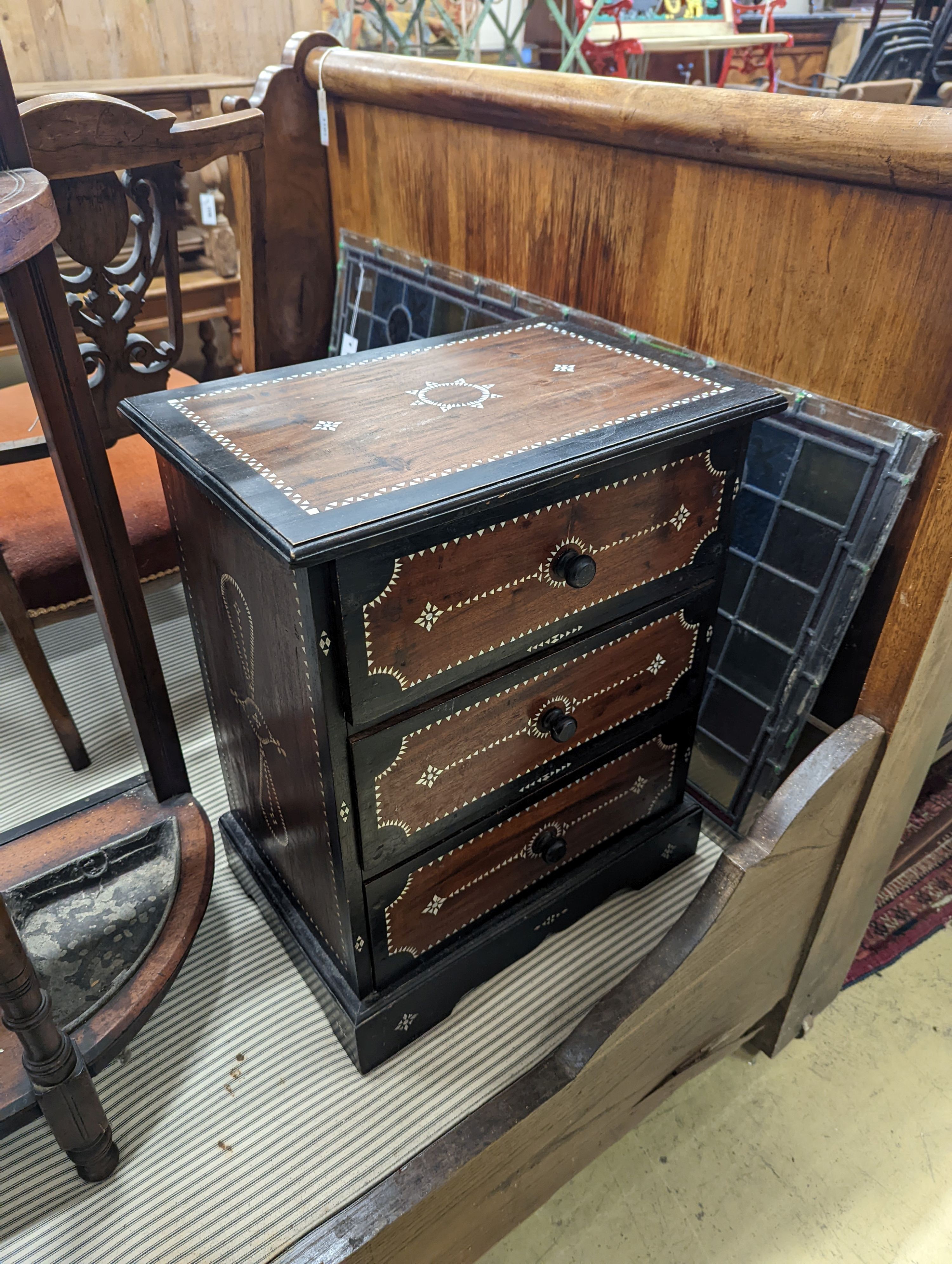 A near pair of South Asian mother of pearl inlaid three drawer small chests, larger 46cm, depth 31cm, height 54cm